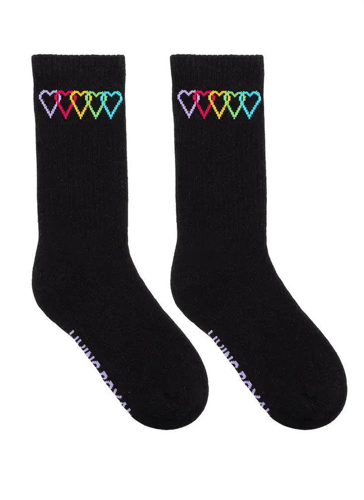 Black socks with colorful heart designs on a white background