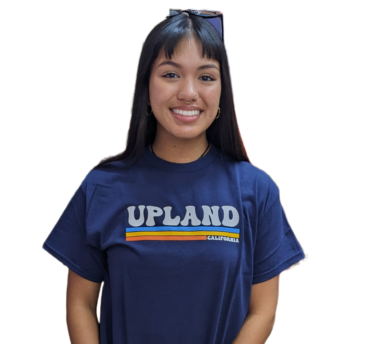 A person wearing a navy blue Empire Shop t-shirt with the retro Upland logo, available in white text.